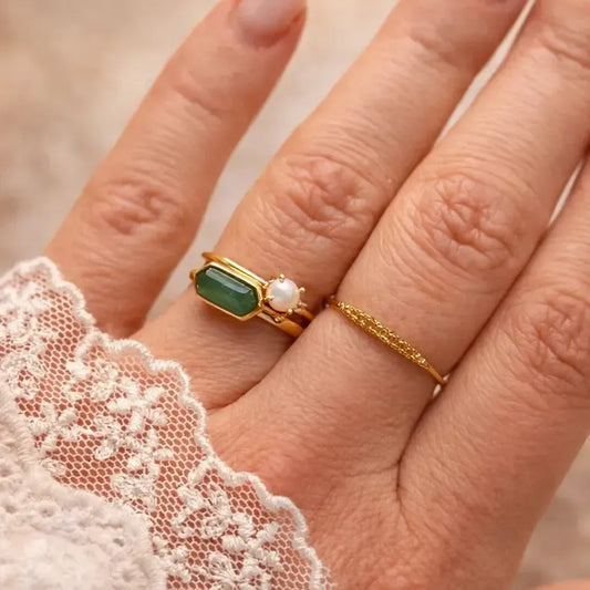 Ring with pearl and topaz