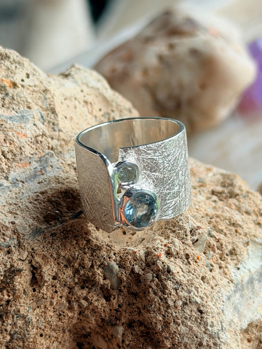Silver ring with topaz