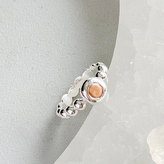Silver ring with peach moonstone