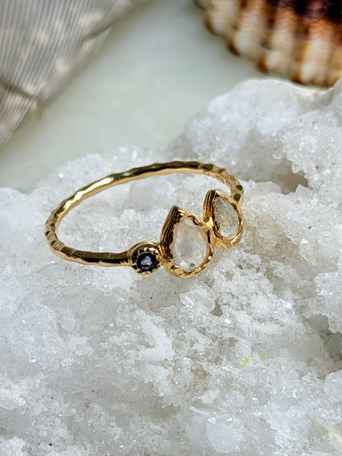 Ring with labradorite, moonstone, and iolite crystals